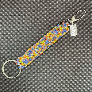 Neon multicolored Paracord keychain with clip and charm.